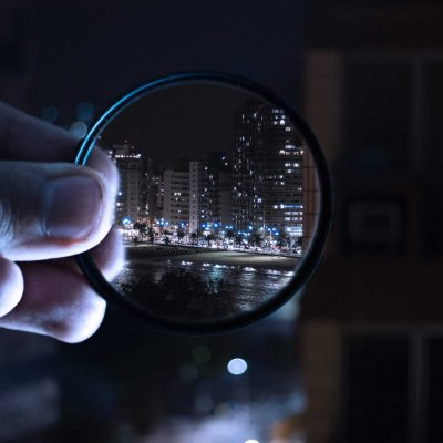 person-holding-magnifying-glass-712786